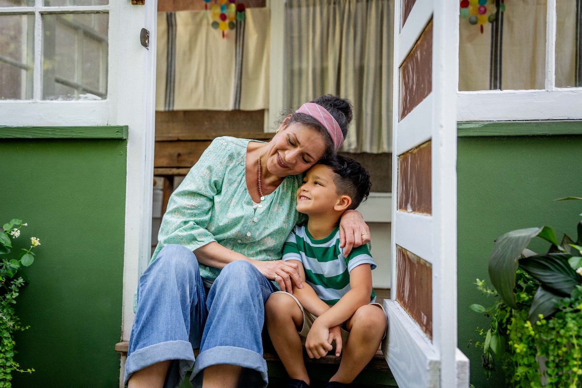 Woman-Hugging-Boy-in-Doorway
